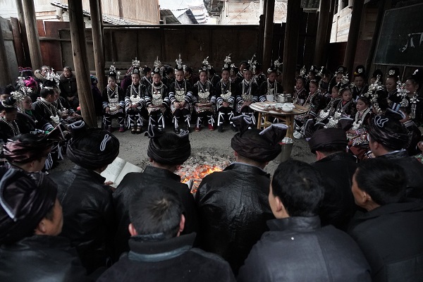 Young Kam men and women exchanging songs in a drum tower