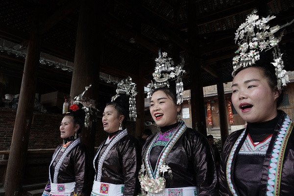Female Kam singers performing an Onomatopoeic Grand Song